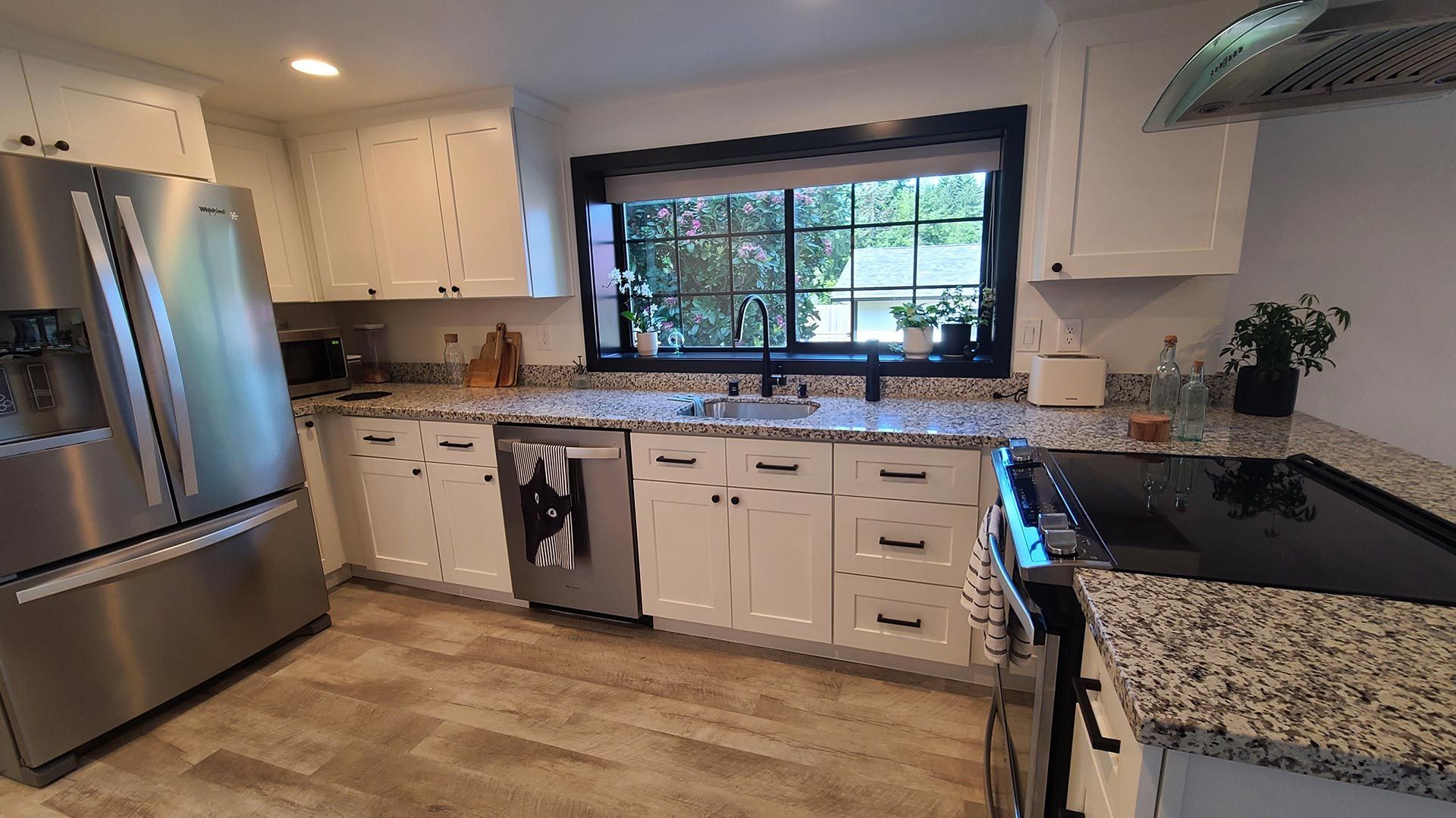 Elegant Kitchen with White Cabinets and Wooden Floor