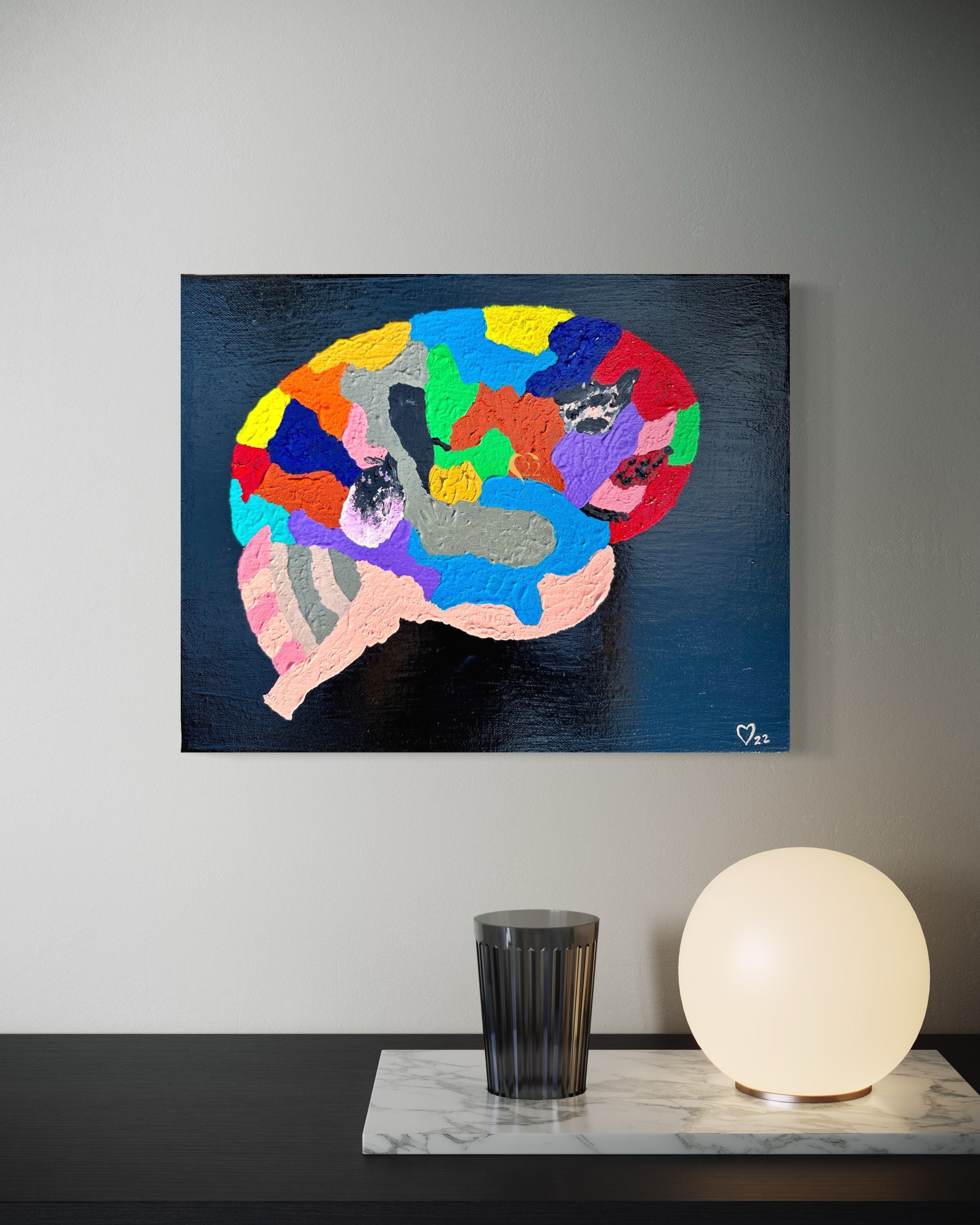 A painting of a colorful brain is hanging on a wall