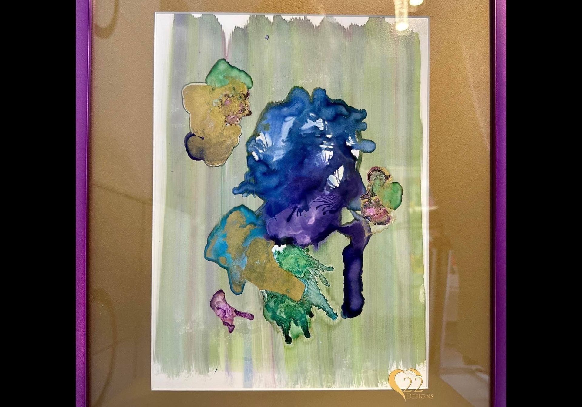 A painting in a purple frame with a green background