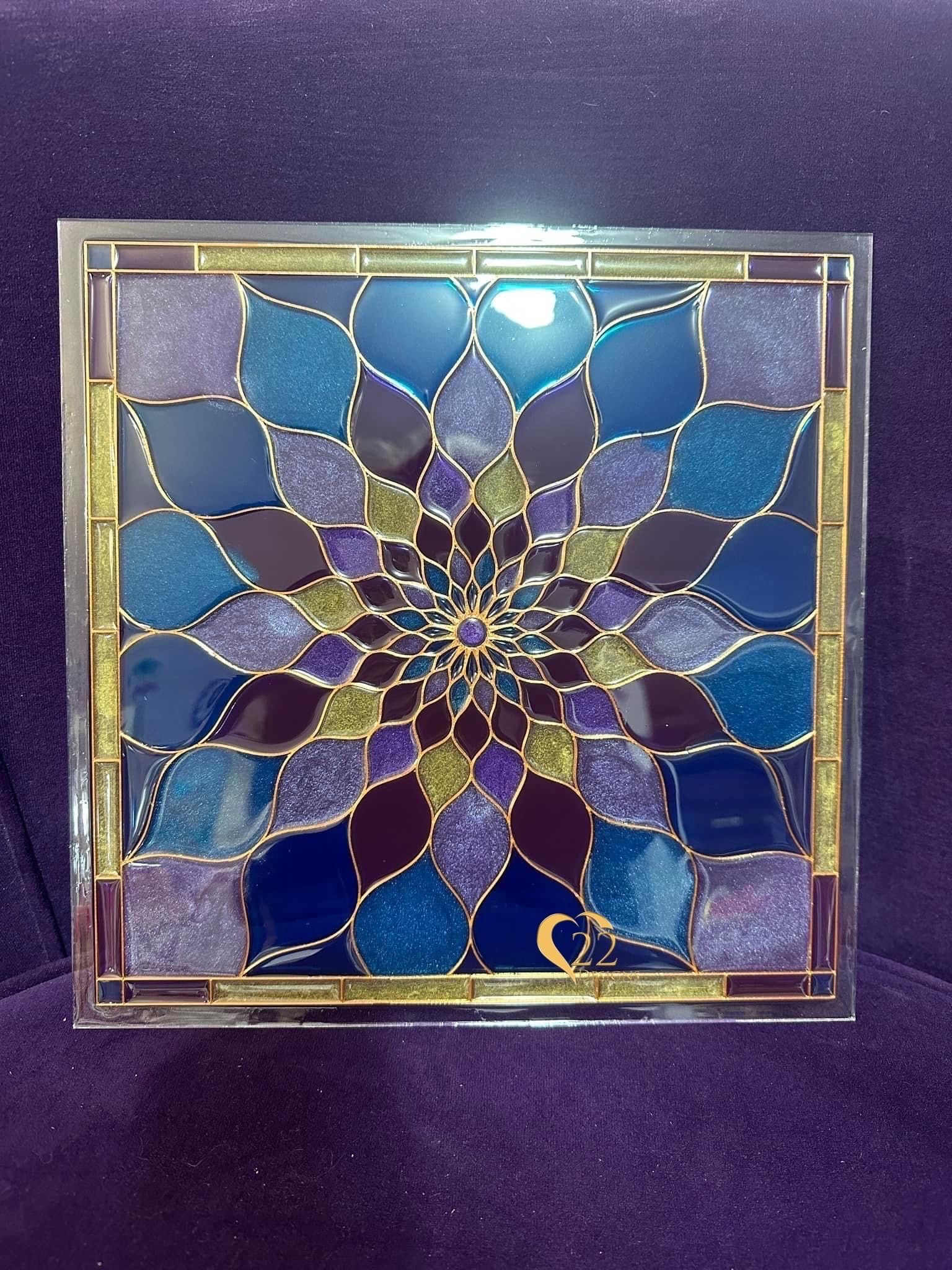 A stained glass window with a blue and purple design