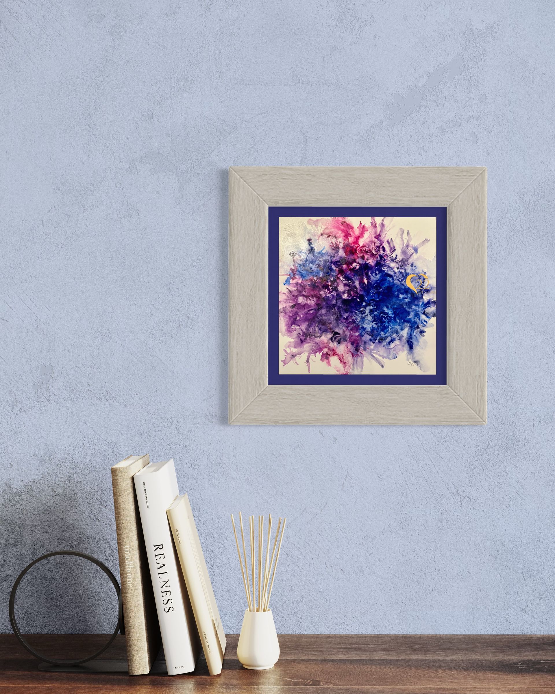 A painting is hanging on a wall next to books