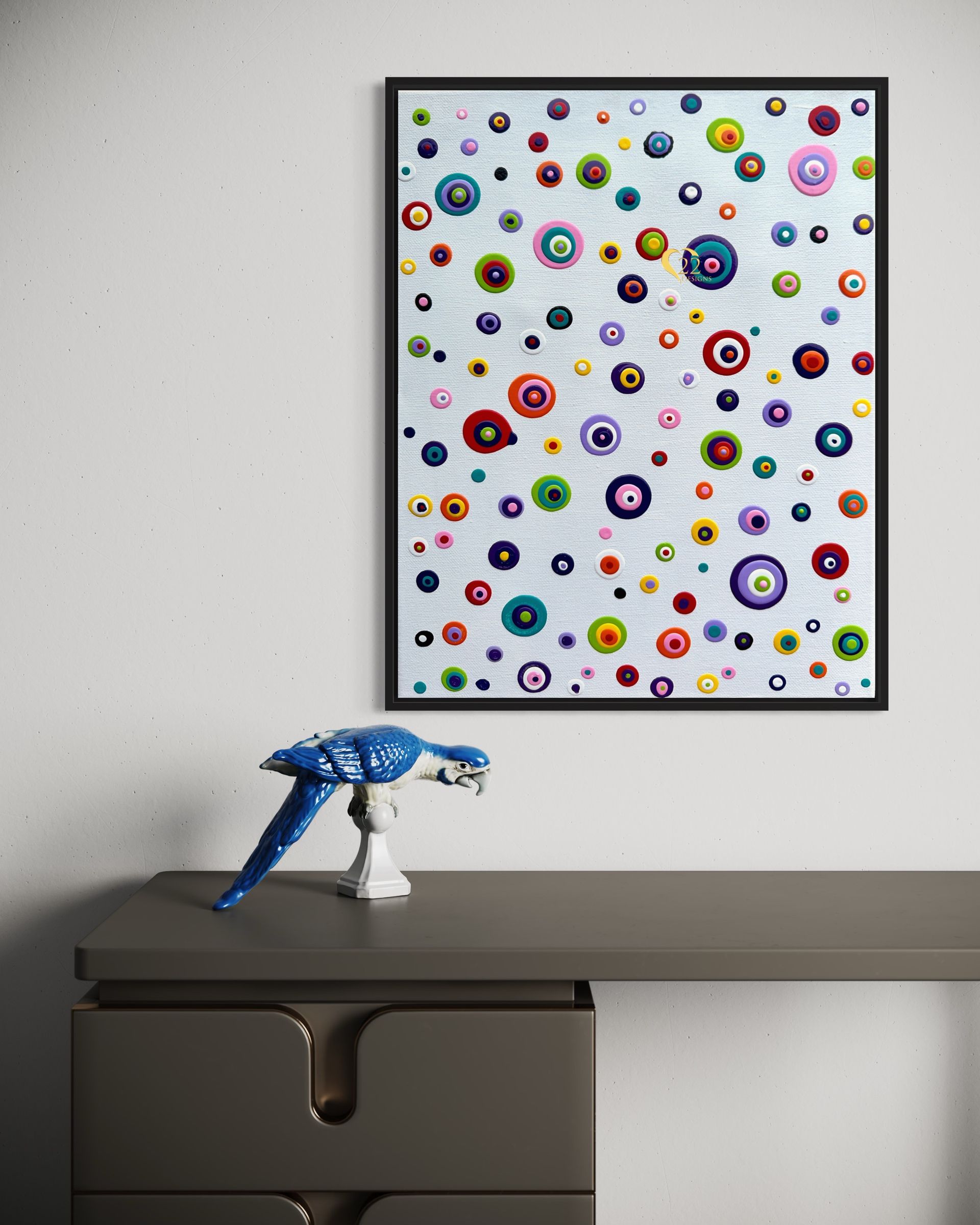 A painting is hanging on a wall above a desk.