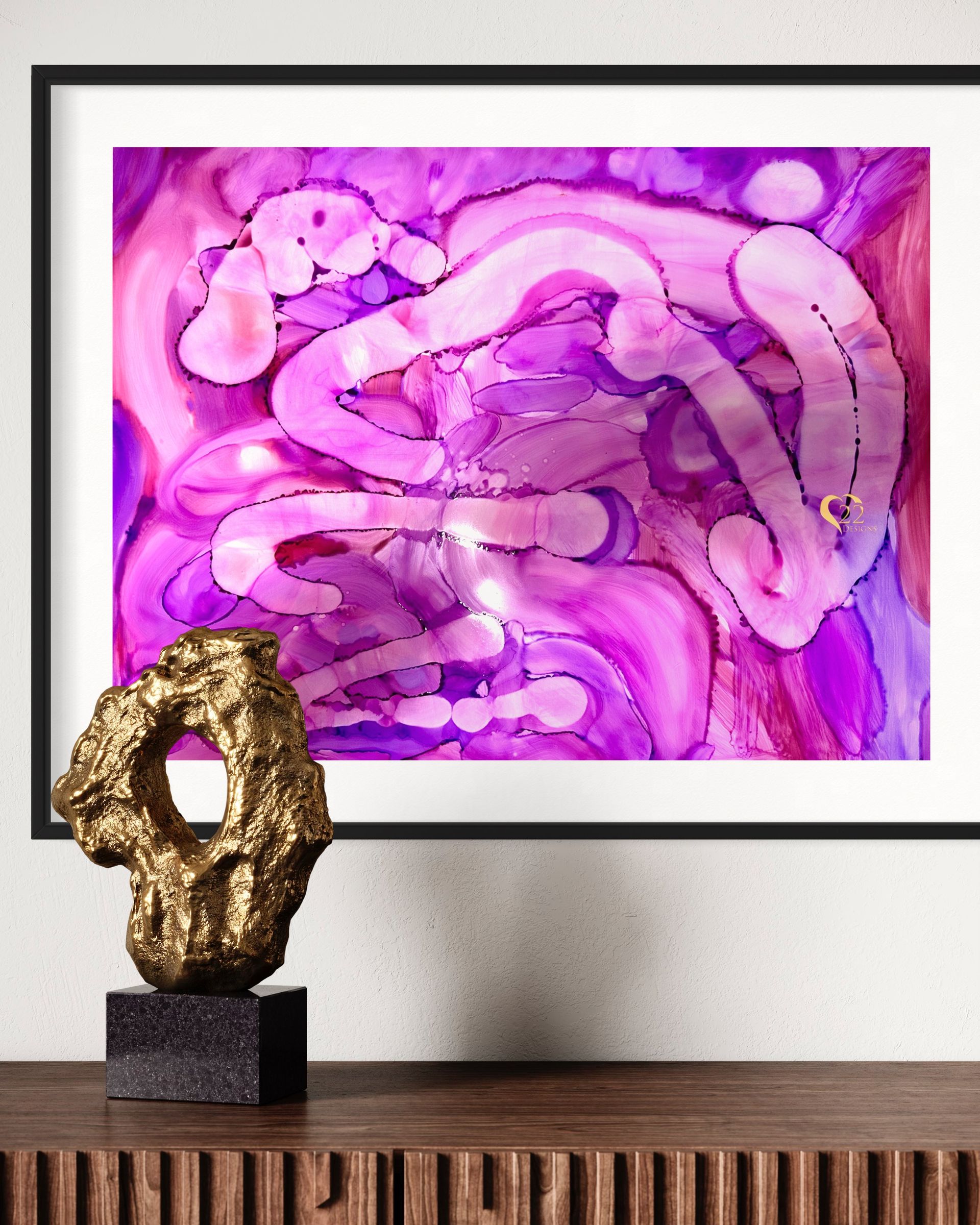 A framed picture of a purple and pink abstract painting