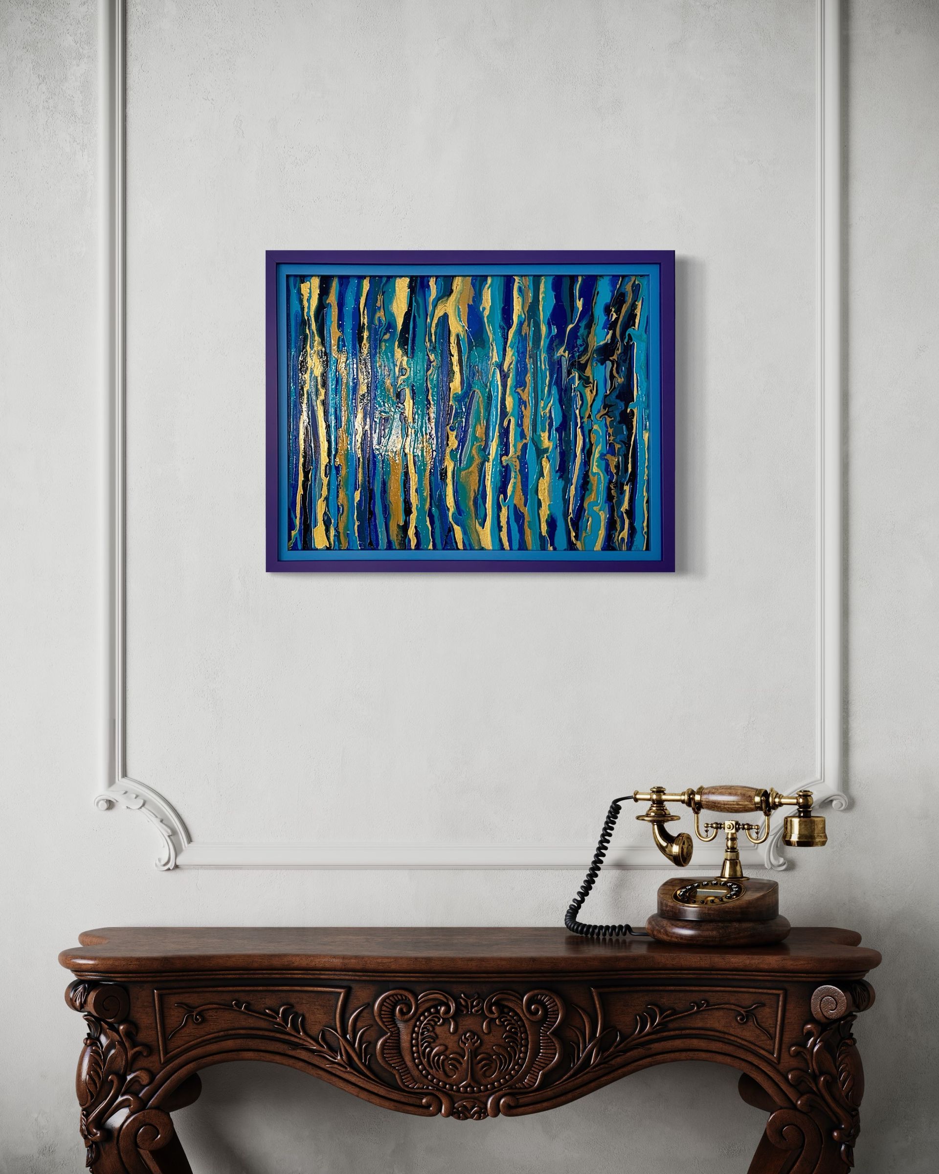 A painting is hanging on a wall above a wooden table.