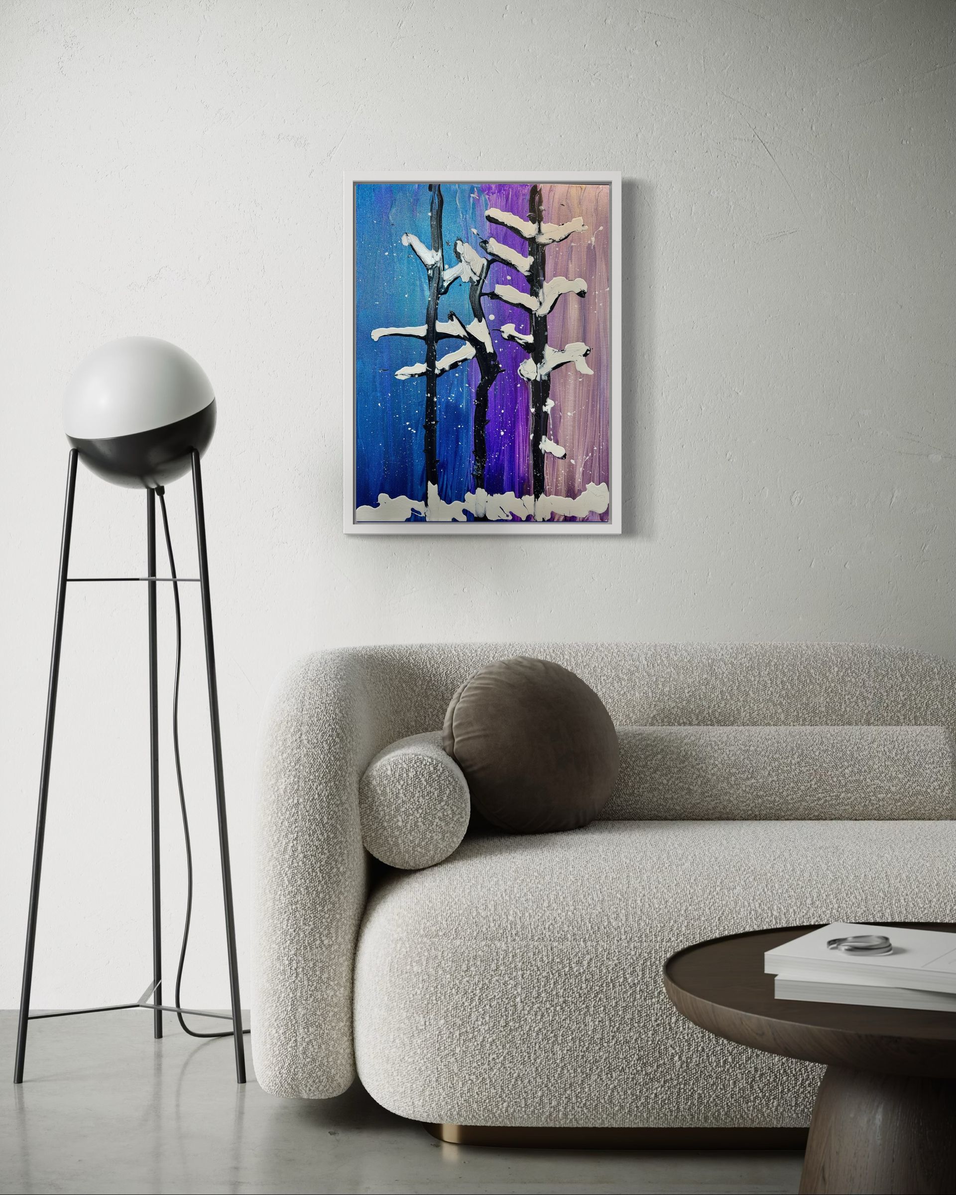 A living room with a couch , table , lamp and painting on the wall.