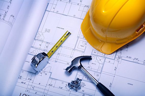 Construction plan with helmet, meter, hammer and nails