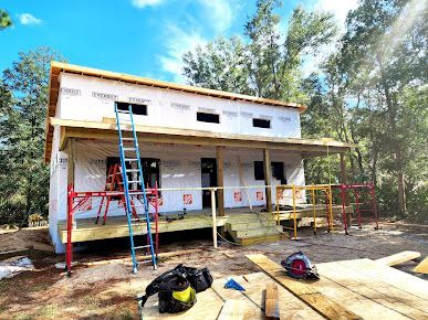 A house is being built in the middle of a forest.