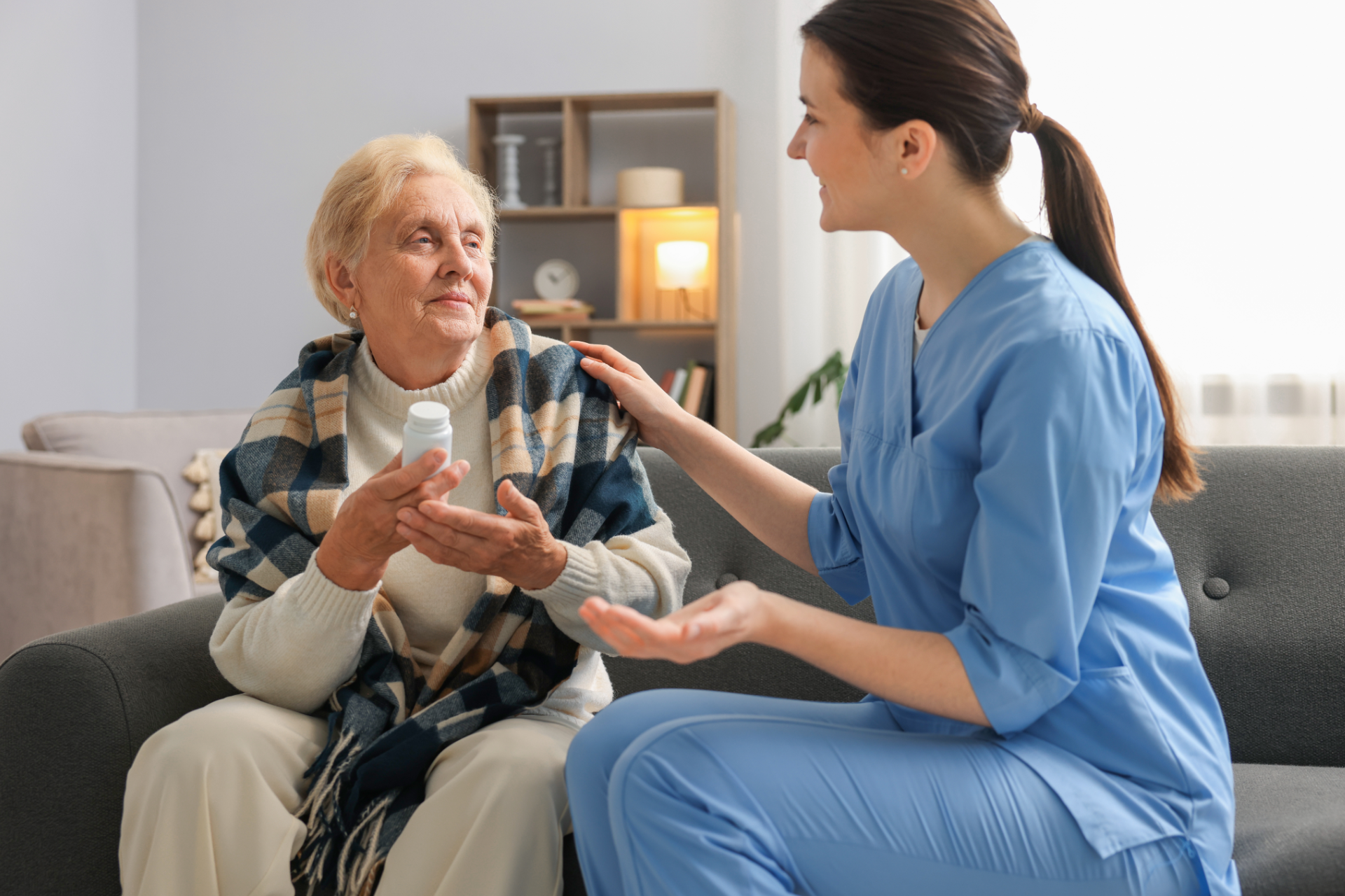 Real estate agent handing keys to a smiling couple after signing a contract.