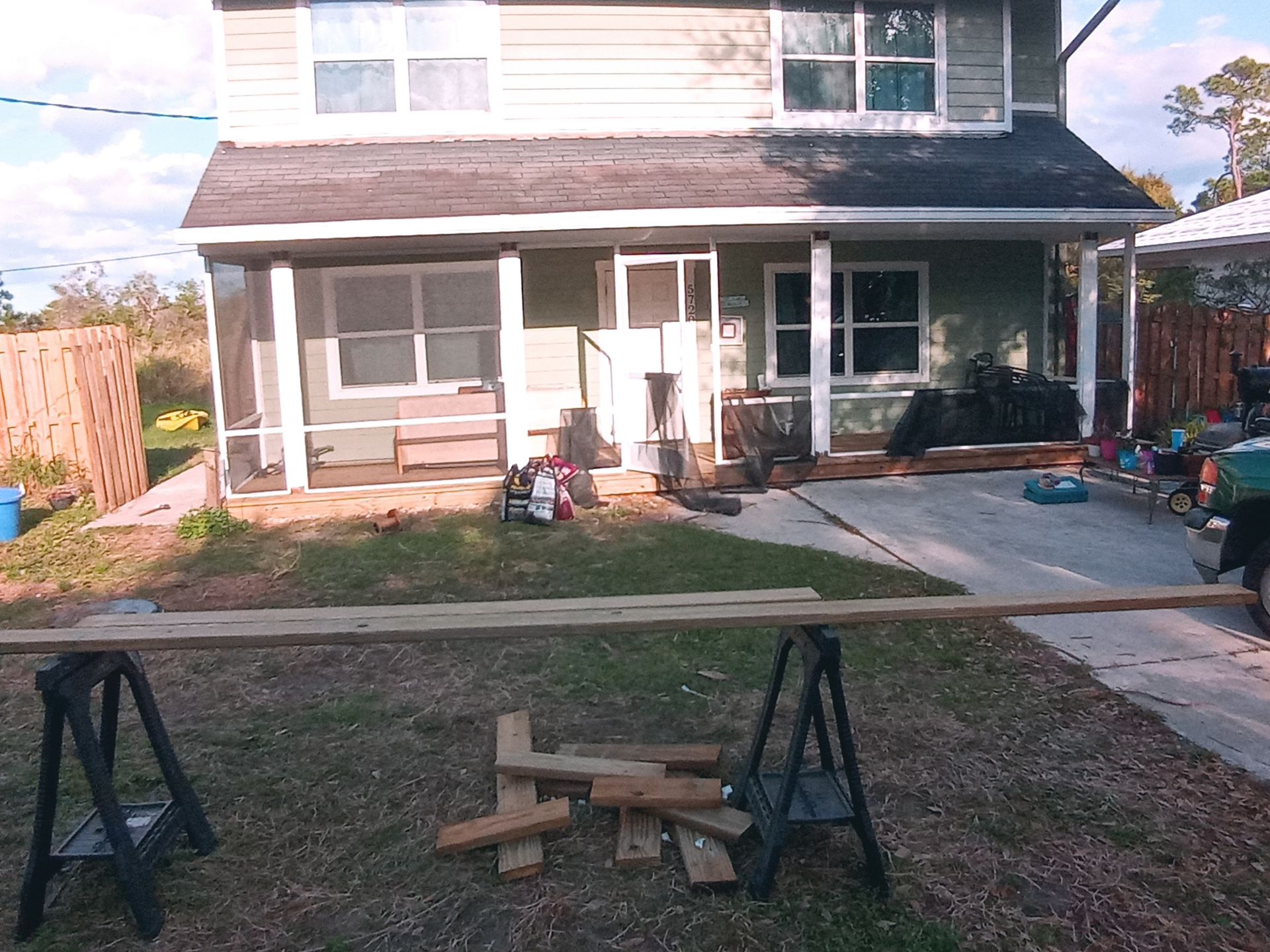 A house with a lot of wood in front of it