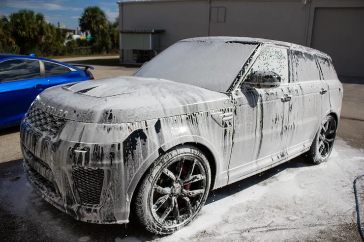A range rover sport is covered in foam.