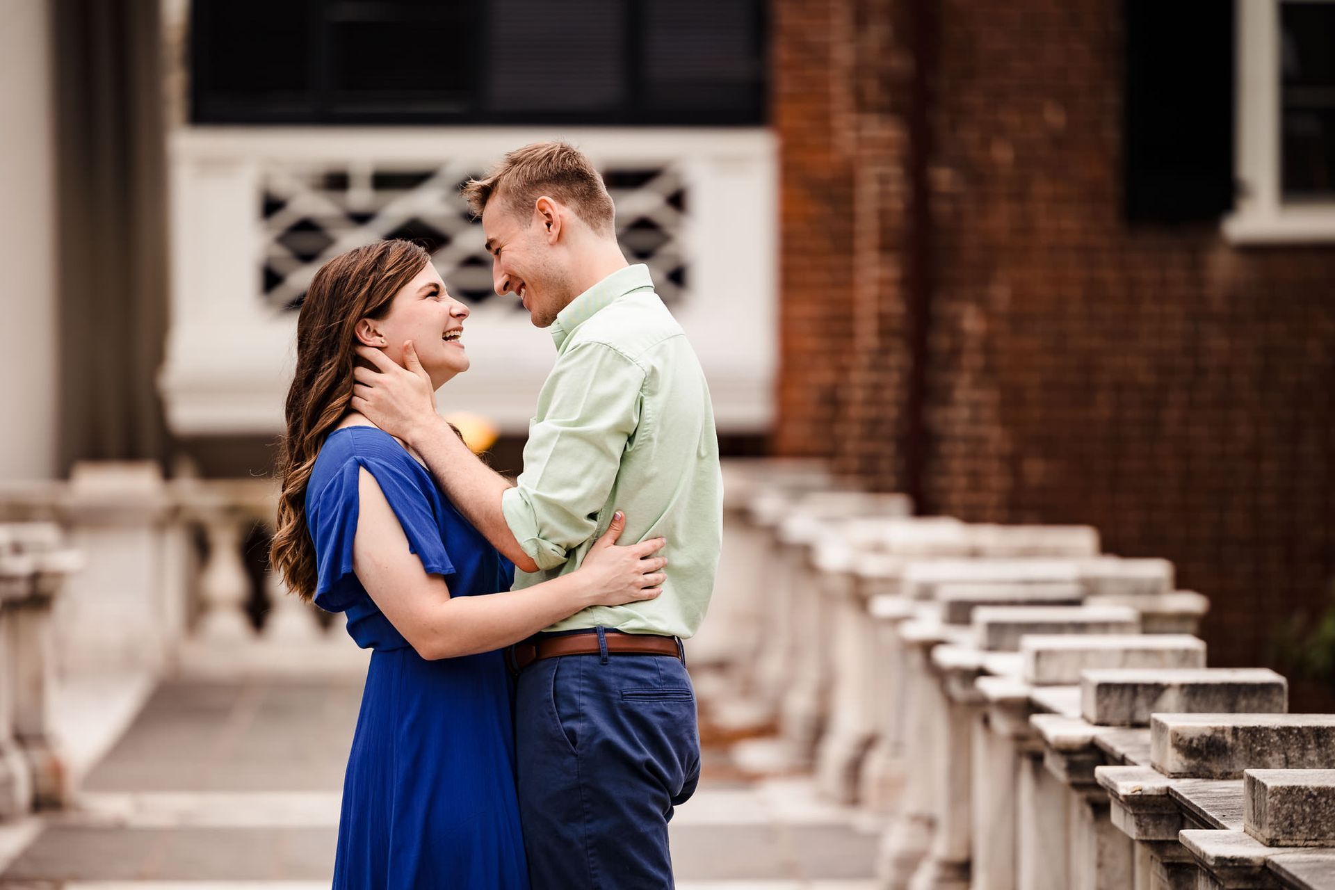 A man and a woman are standing next to each other and looking at each other.