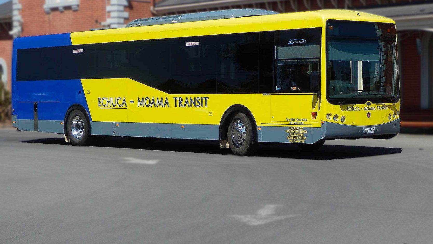 A yellow and blue bus with the word transit on the side