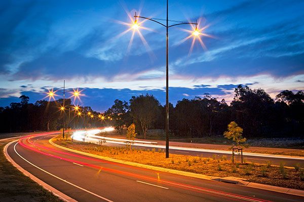 A road with a lot of lights on it at night.