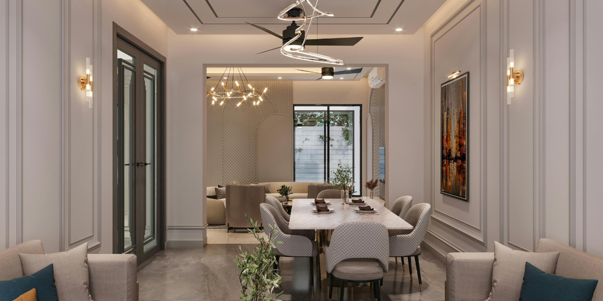 Elegant dining room with table, chairs, artwork, and sofa. Modern interior with mirror, ceiling fan, and sconces.