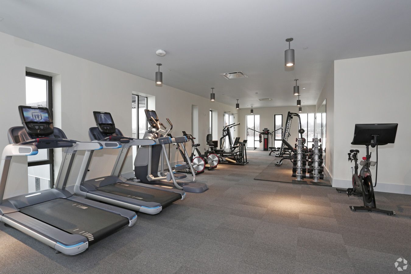 Photo of woman riding spin bike