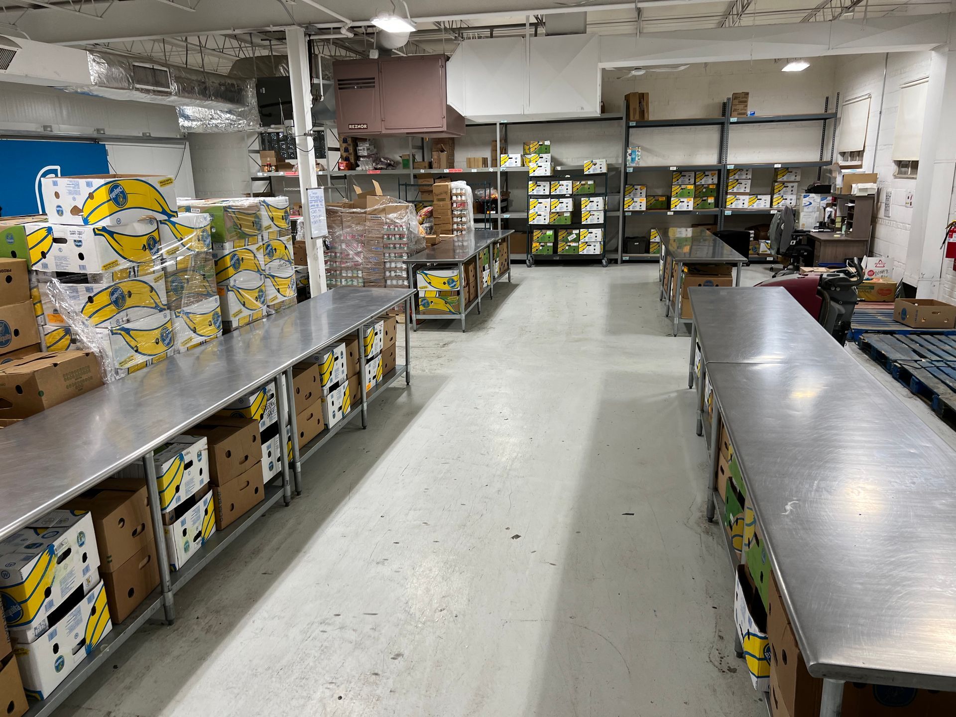A warehouse filled with lots of boxes and tables