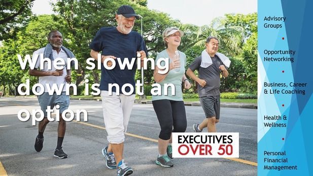 Hand stopping wooden dominoes from falling on a wooden table.