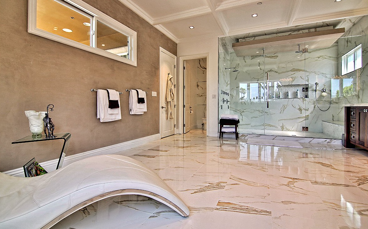 A bathroom with a bathtub and a walk in shower.