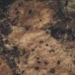 A close up of a brown and black granite counter top.