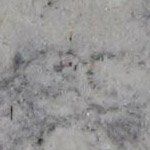 A close up of a gray granite counter top.