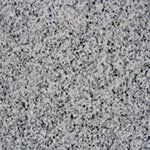 A close up of a gray granite counter top.