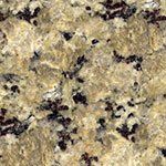 A close up of a granite counter top with black spots.