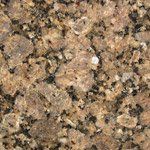 A close up of a brown granite counter top.