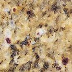 A close up of a piece of bread with a lot of crumbs on it.