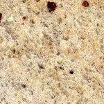 A close up of a granite counter top with a grainy texture.