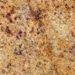 A close up of a yellow granite counter top.