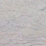A close up of a white granite counter top.