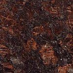 A close up of a brown granite counter top.