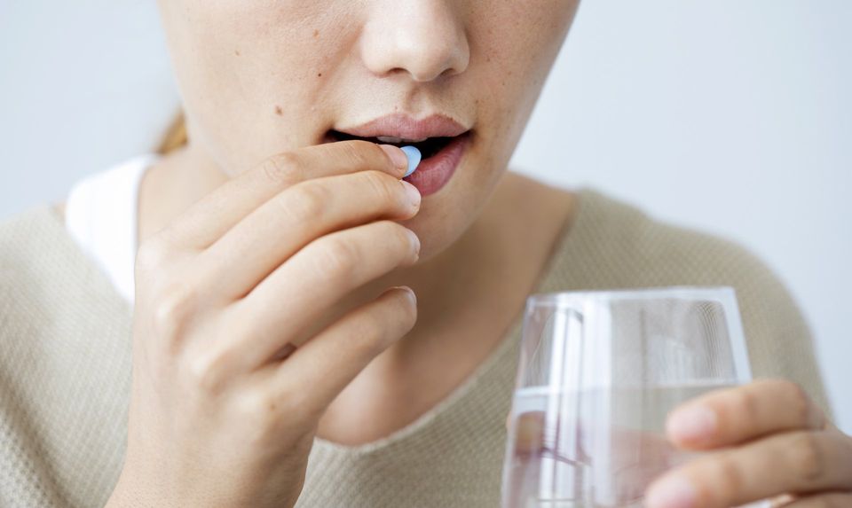 Woman taking Medication