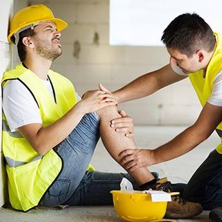 Man on construction with injuried leg