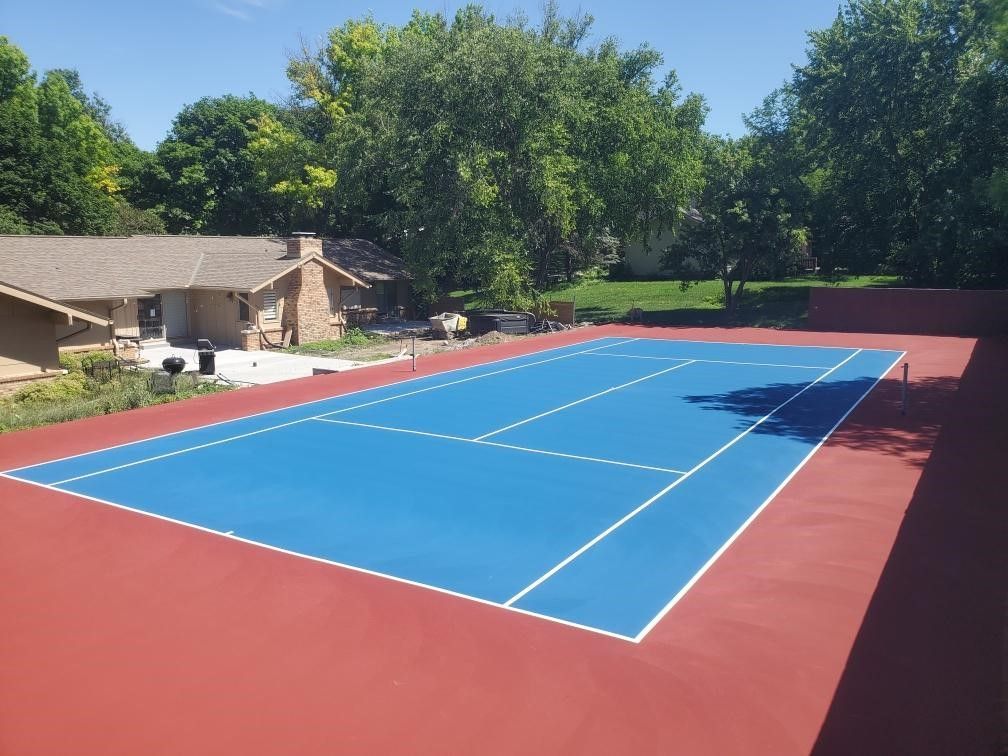 Red And Blue Color Tennis Court — Nebraska City, NE — TCU Inc