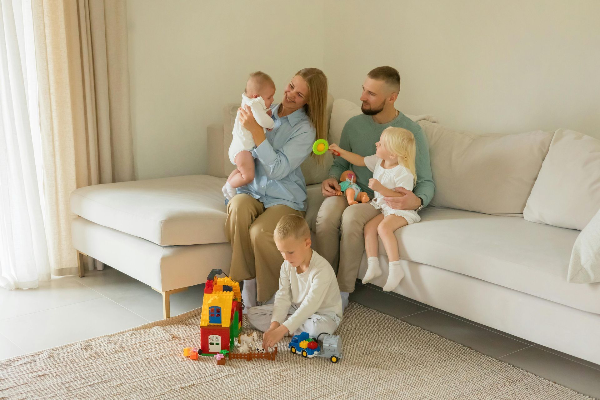 Man shows older man tablet while cooking in kitchen.