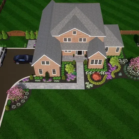 An aerial view of a house with a car parked in front of it