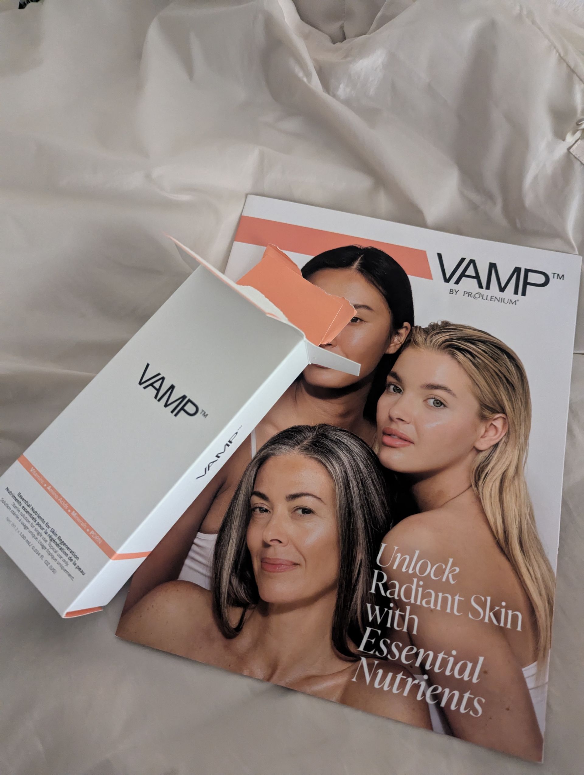 A box of vamp essential nutrients is sitting on top of a magazine.