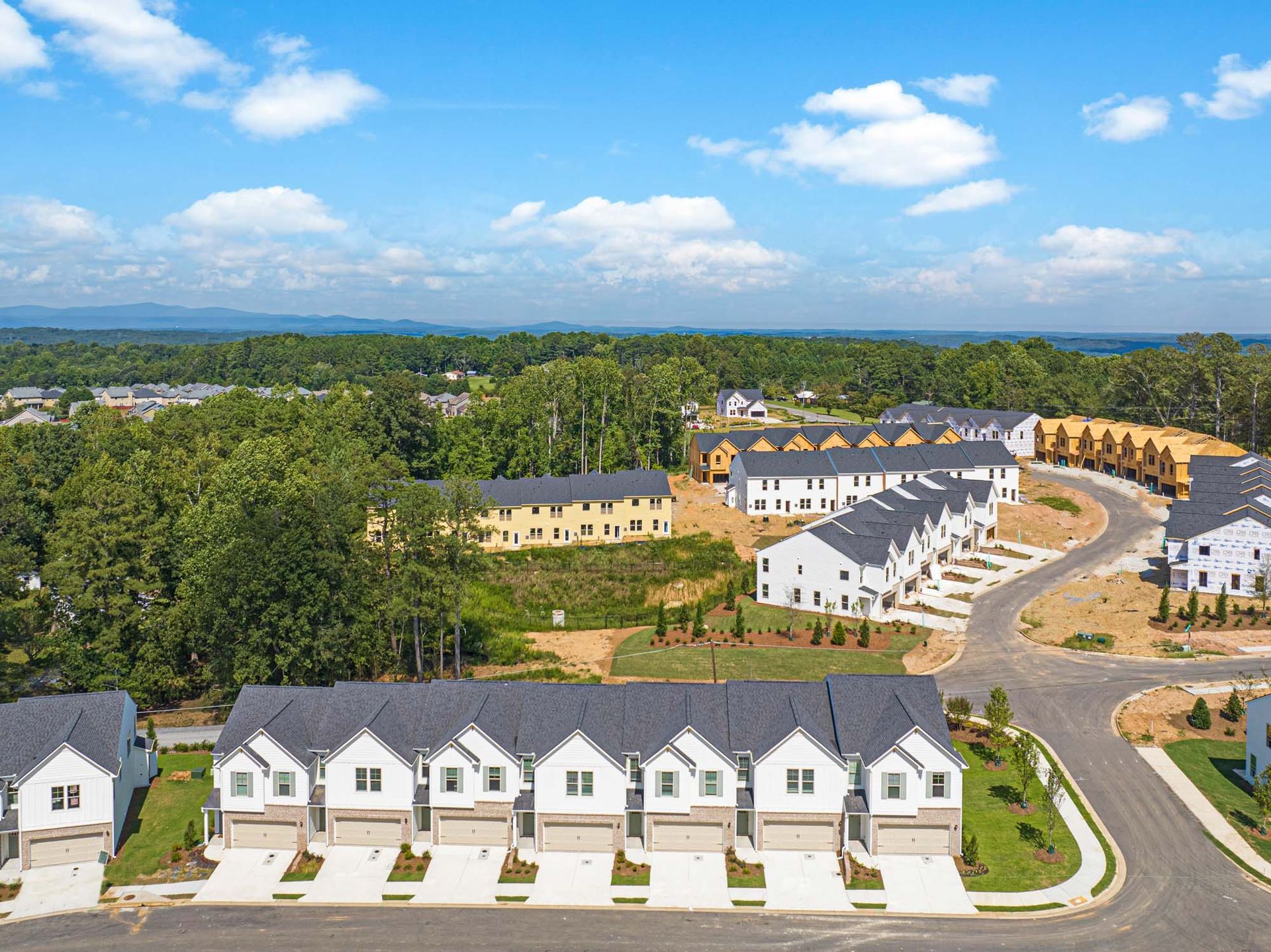 An aerial view of a row of houses in a residential area at Mayridge Canton FKA Summerwalk Townhomes