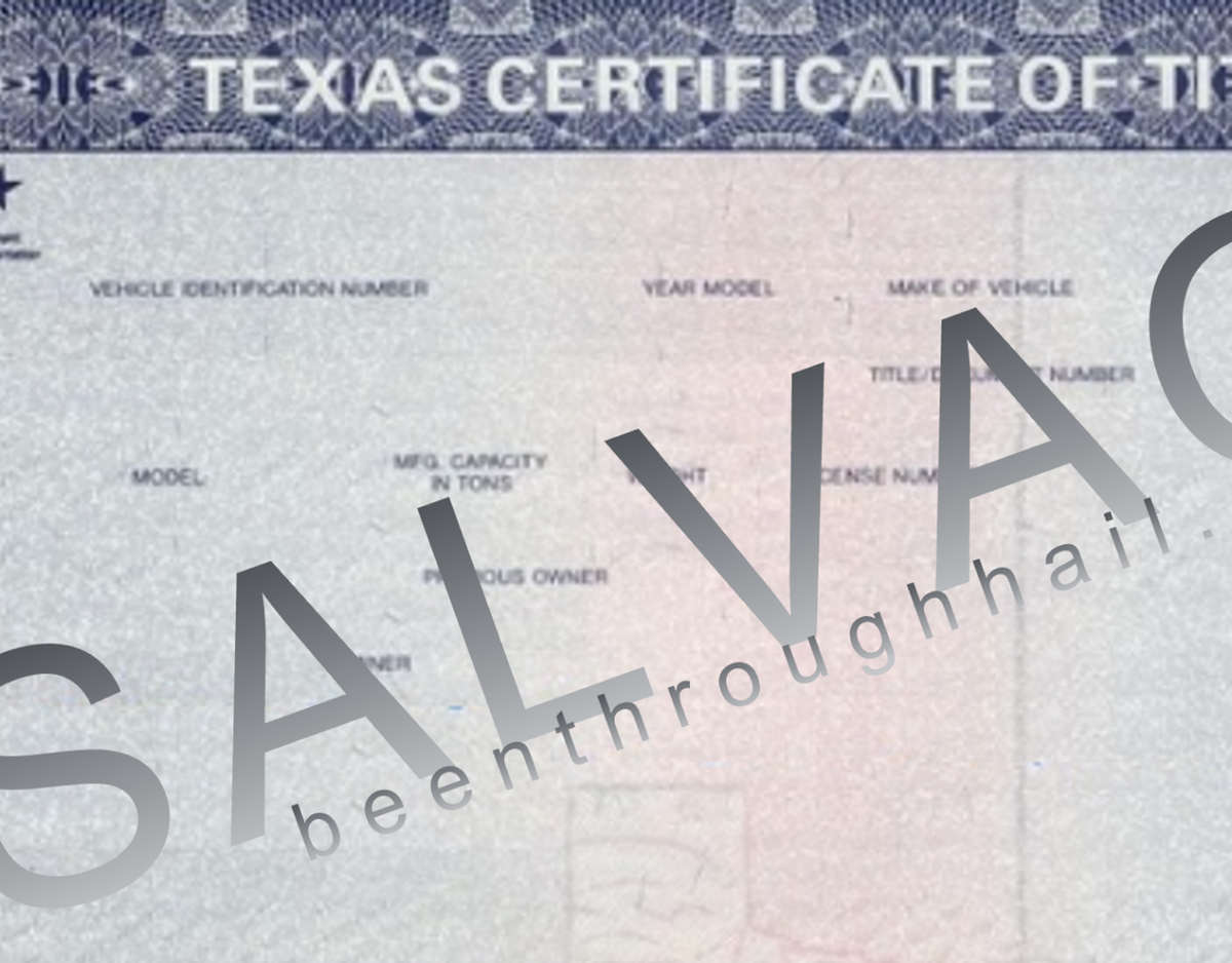 A close up of a Texas certificate of salvage title