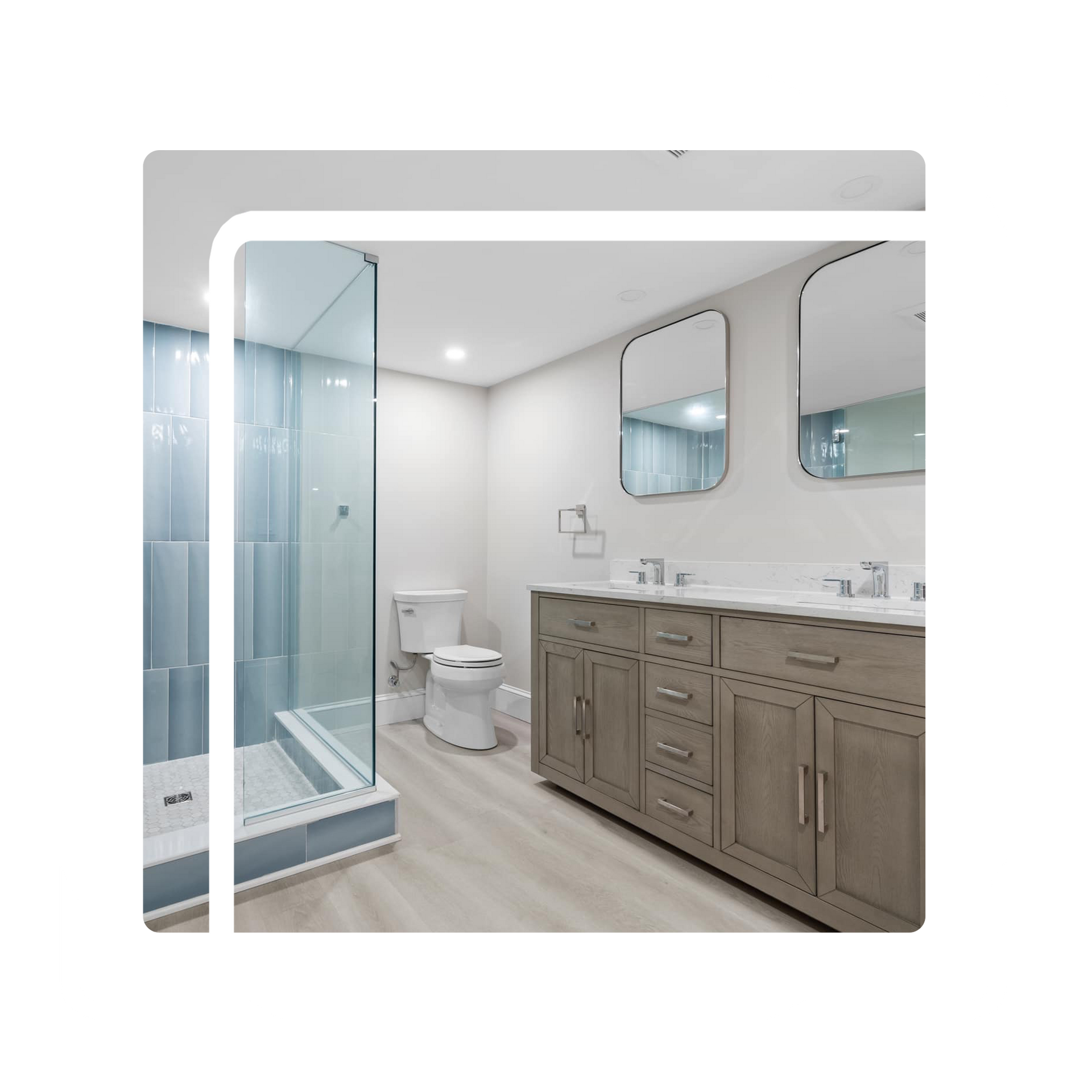 A bathroom with two sinks , a toilet , and a walk in shower. A bathroom with two sinks , a toilet , and a walk in shower.