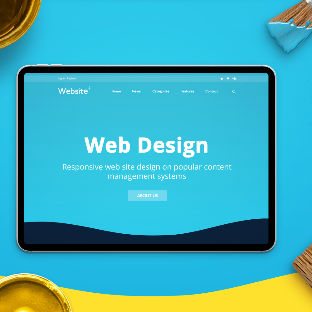 A tablet with a web design website on it