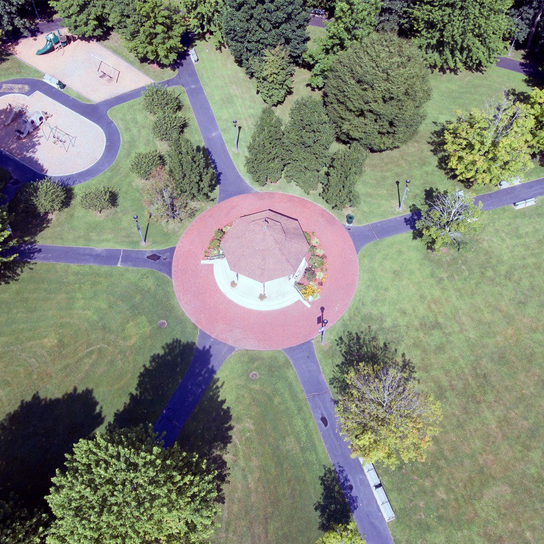 An aerial view of a park with a circle in the middle