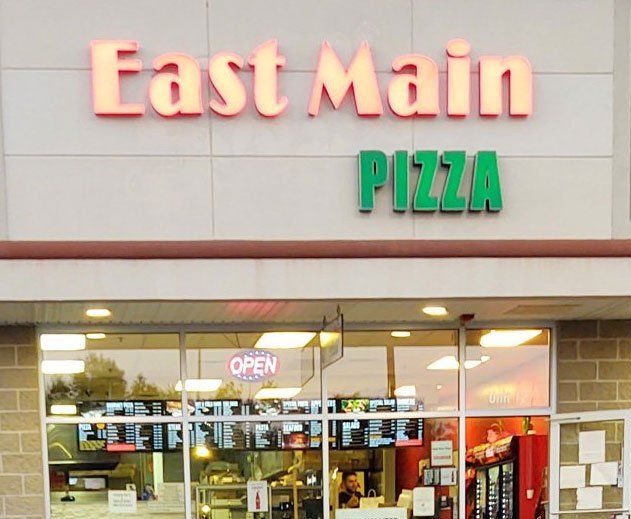 East main pizza is located in a brick building