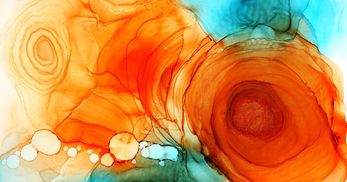 A close up of a painting with orange and blue circles on a white background.