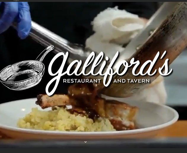 A person is pouring gravy over a plate of food at gallford 's restaurant and tavern