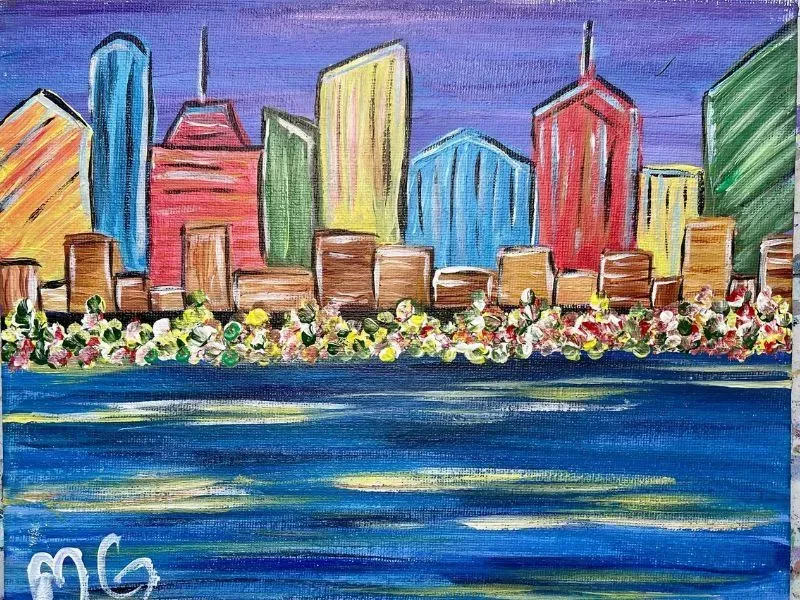 Colorful cityscape with tall buildings, a body of water, and a starry purple sky.