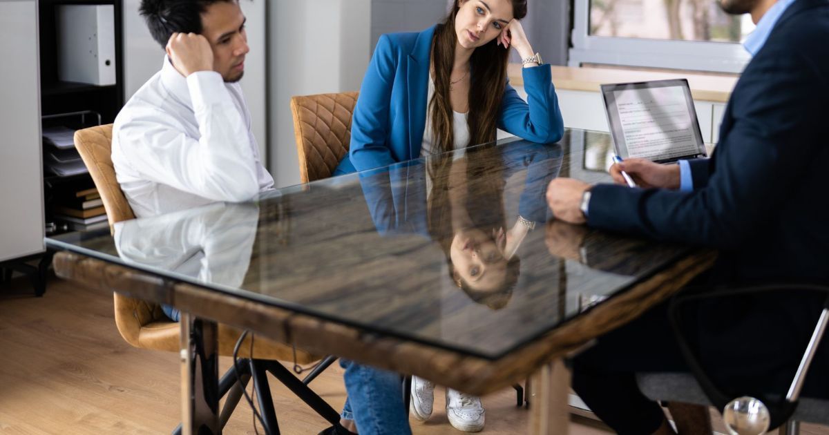 couple talking to lawyer