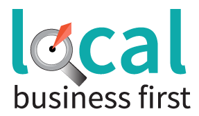 A logo for local business first with a magnifying glass