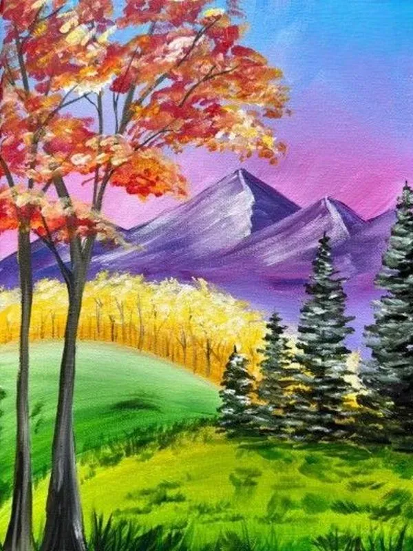 Autumn landscape: colorful trees, mountain range, rolling green hills, and vibrant sunset.